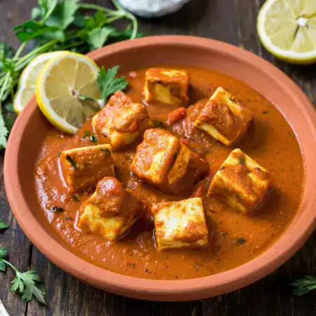 Rich and creamy paneer butter masala with VillageCheese fresh paneer in aromatic tomato and butter gravy